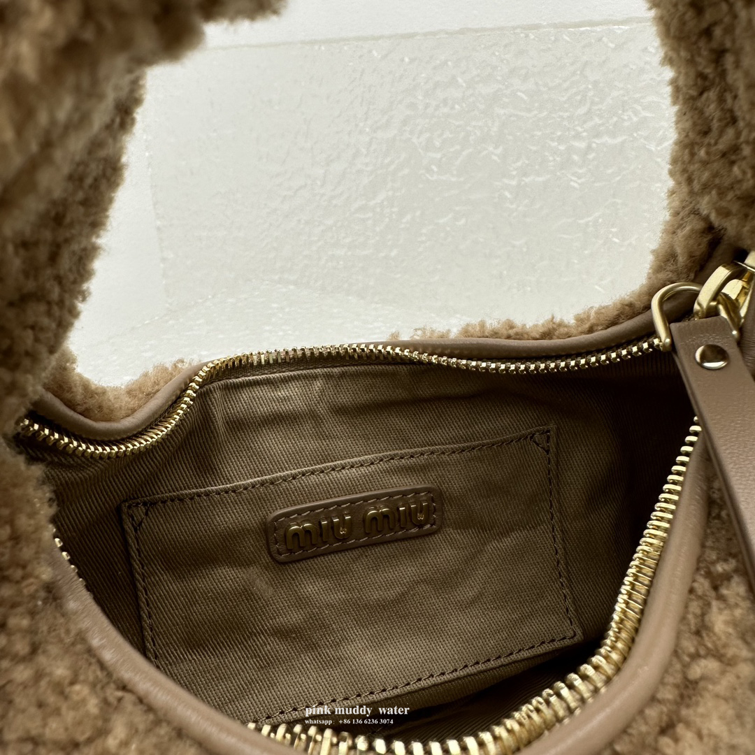 Wander leather detail shearling crescent bag