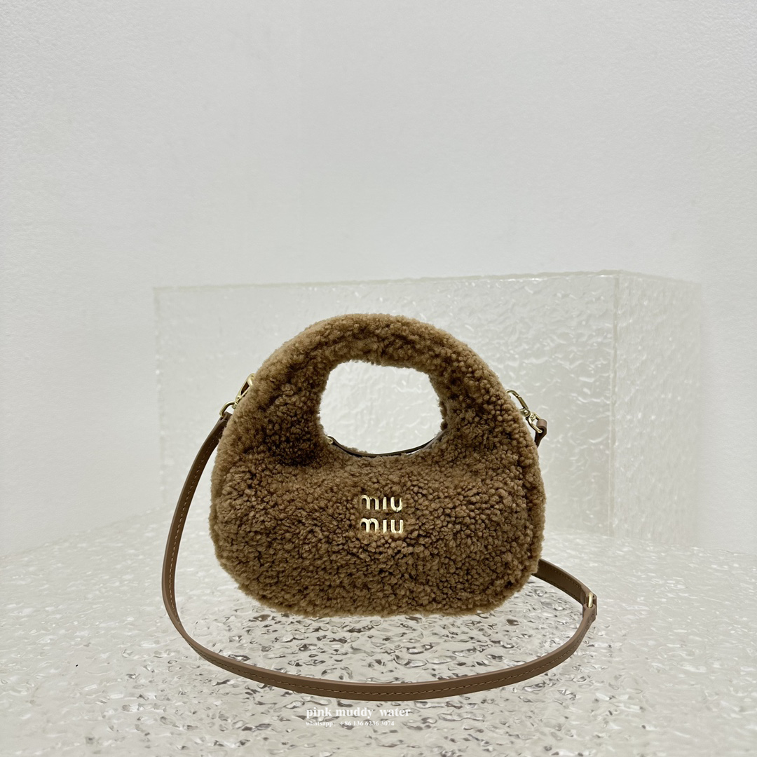 Wander leather detail shearling crescent bag