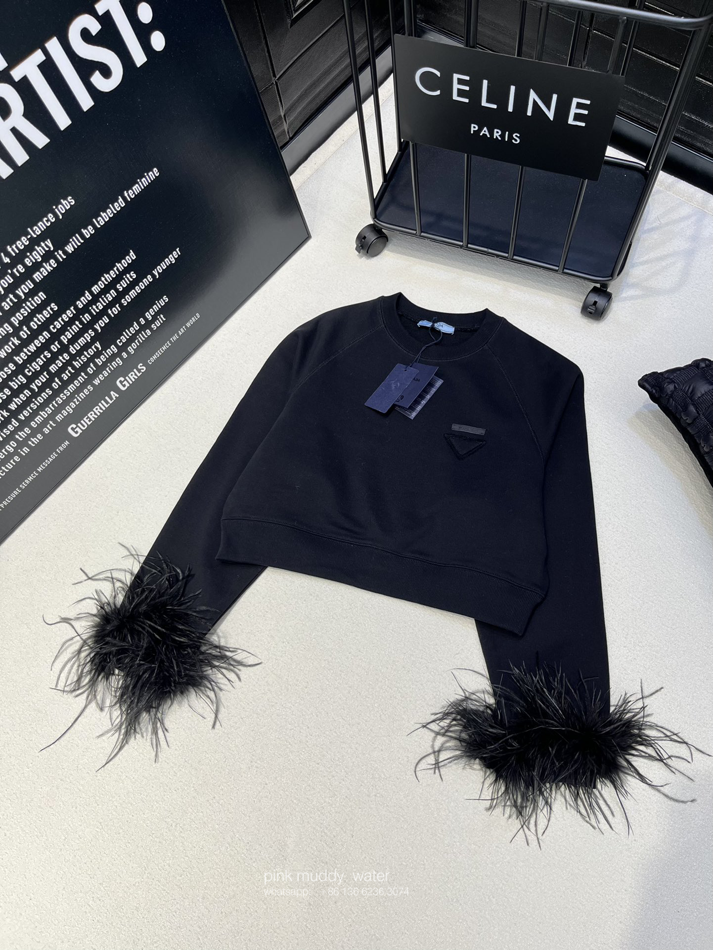 Crew-neck sweatshirt with feather trim