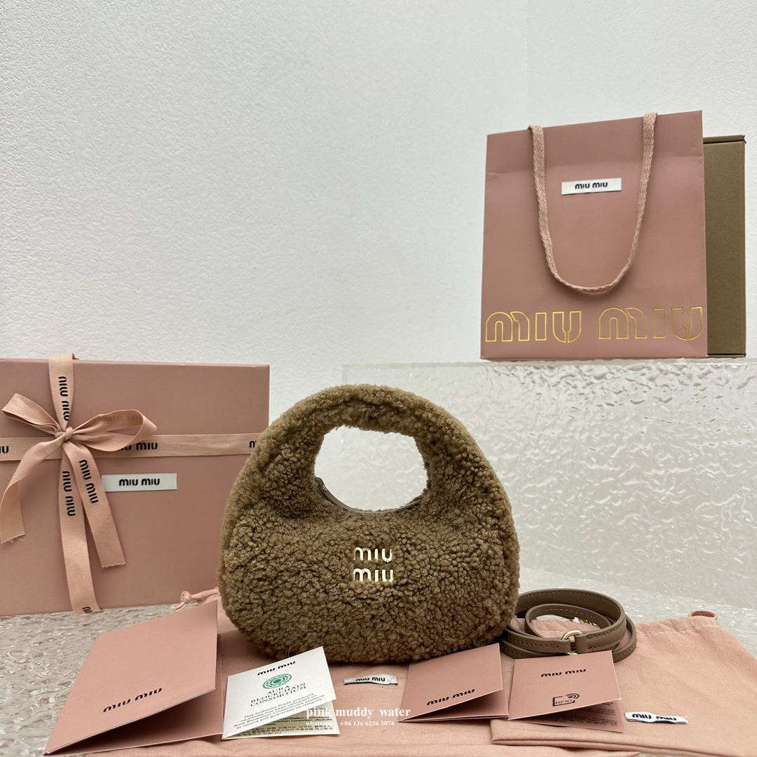 Wander leather detail shearling crescent bag