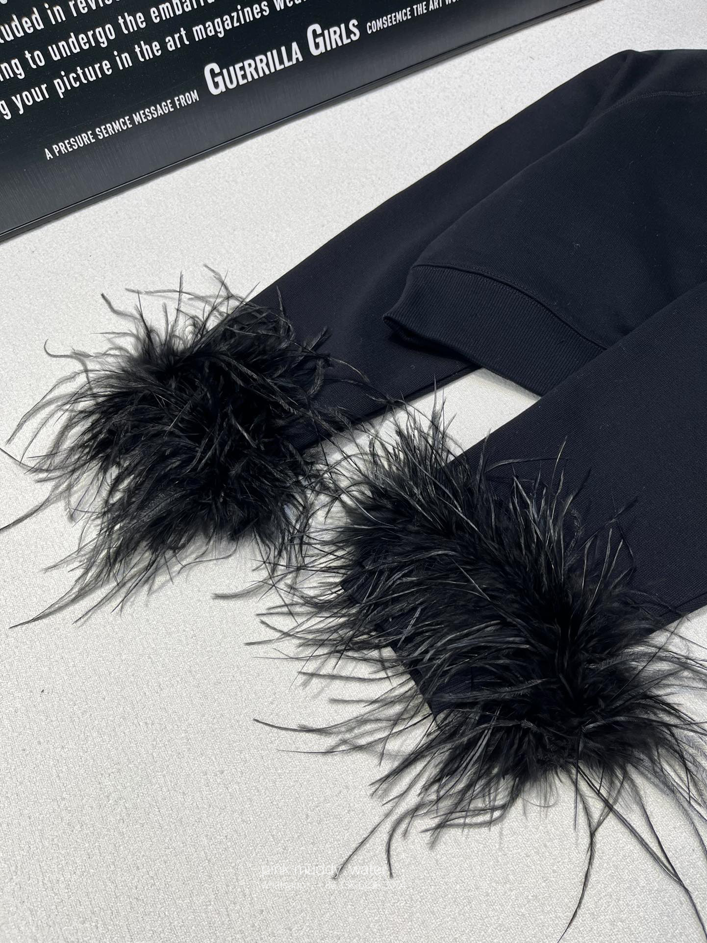 Crew-neck sweatshirt with feather trim