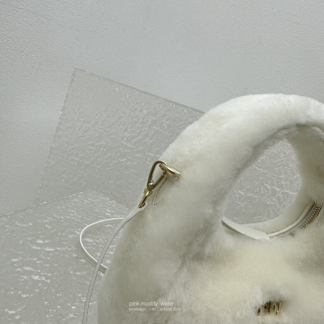 Wander leather detail shearling crescent bag