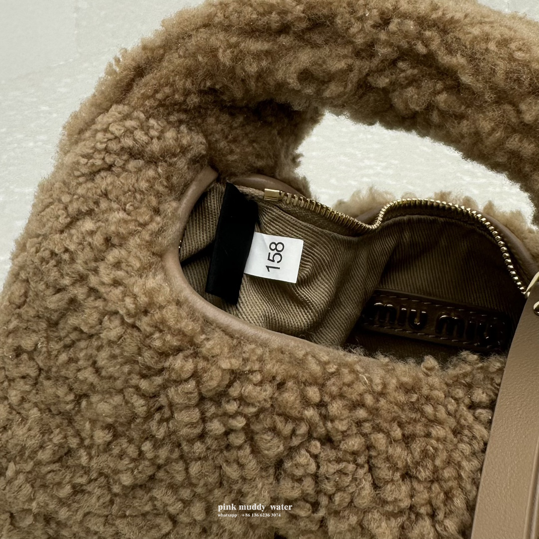 Wander leather detail shearling crescent bag