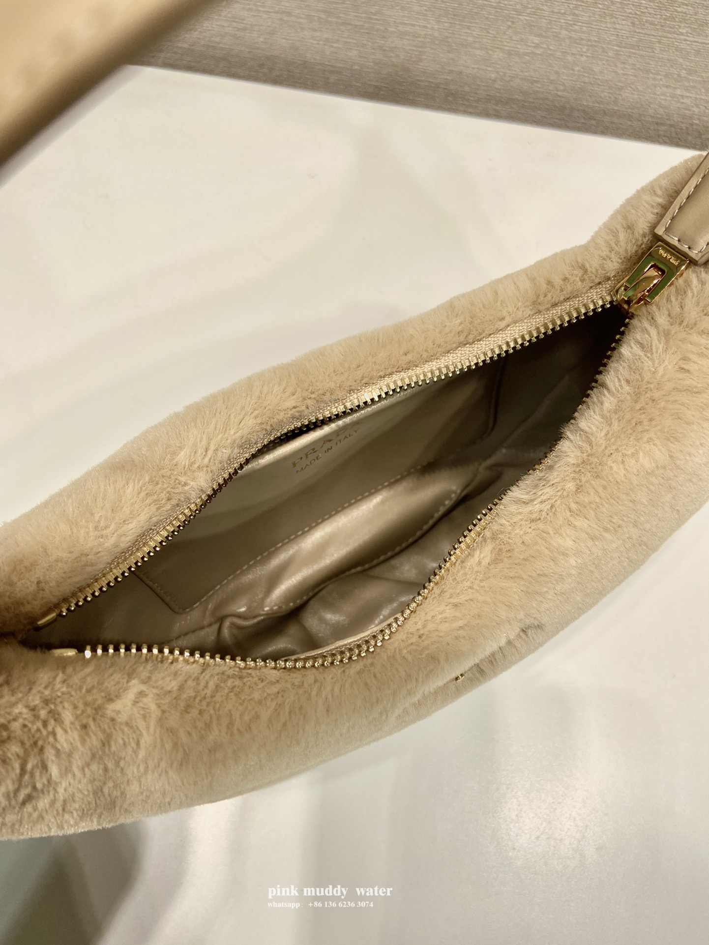 Prada Arqué shearling and leather shoulder bag