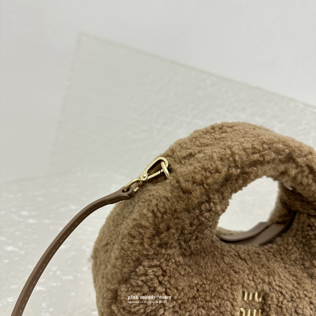 Wander leather detail shearling crescent bag