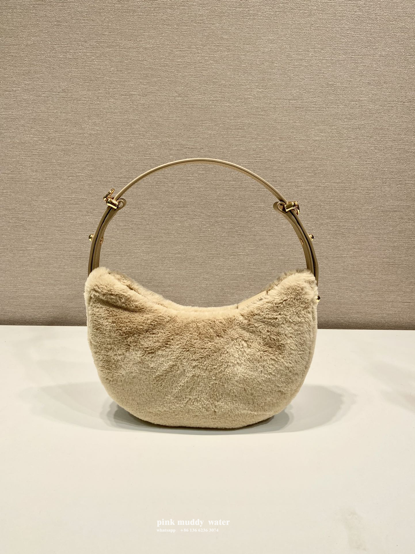 Prada Arqué shearling and leather shoulder bag