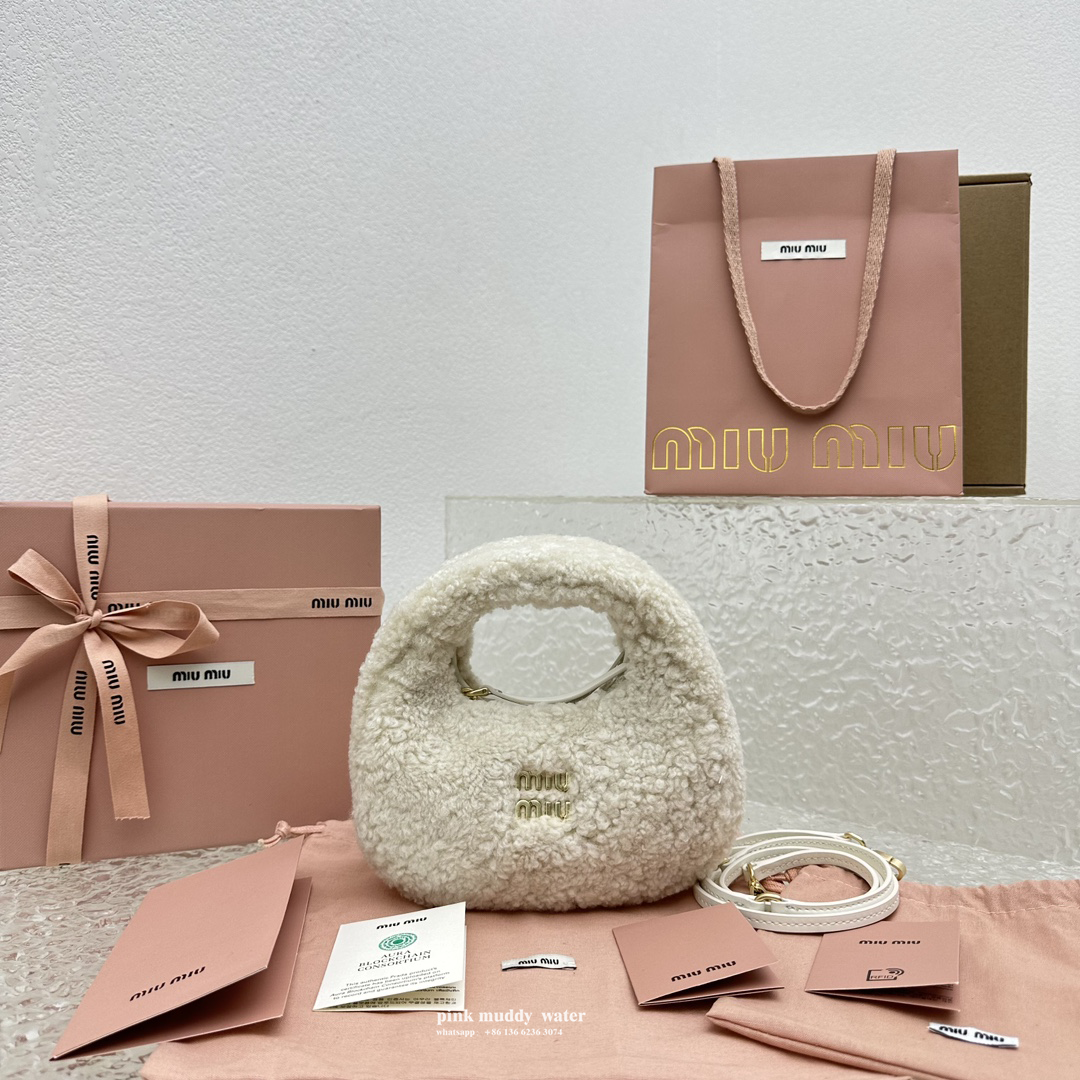 Wander leather detail shearling crescent bag