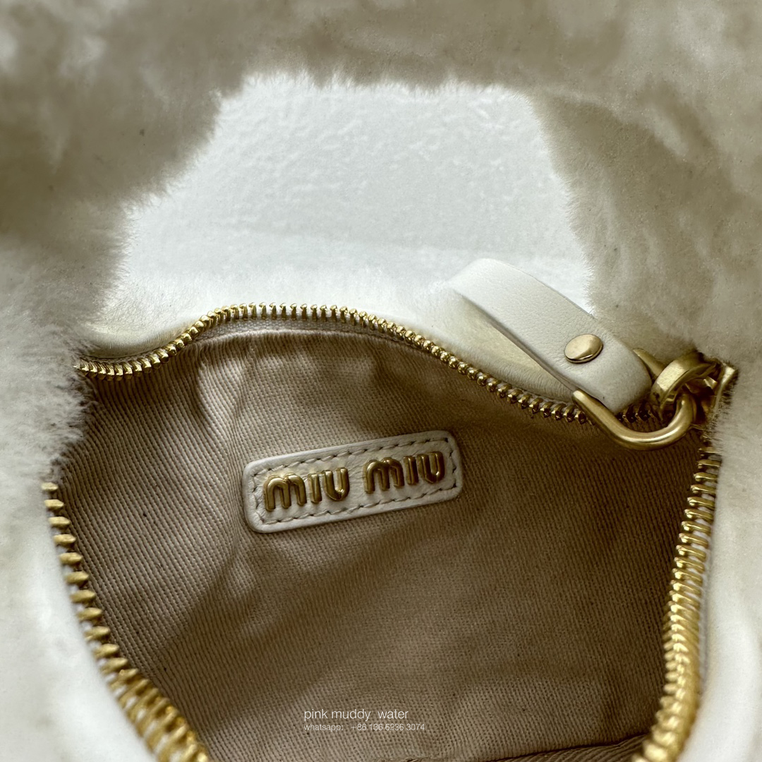Wander leather detail shearling crescent bag