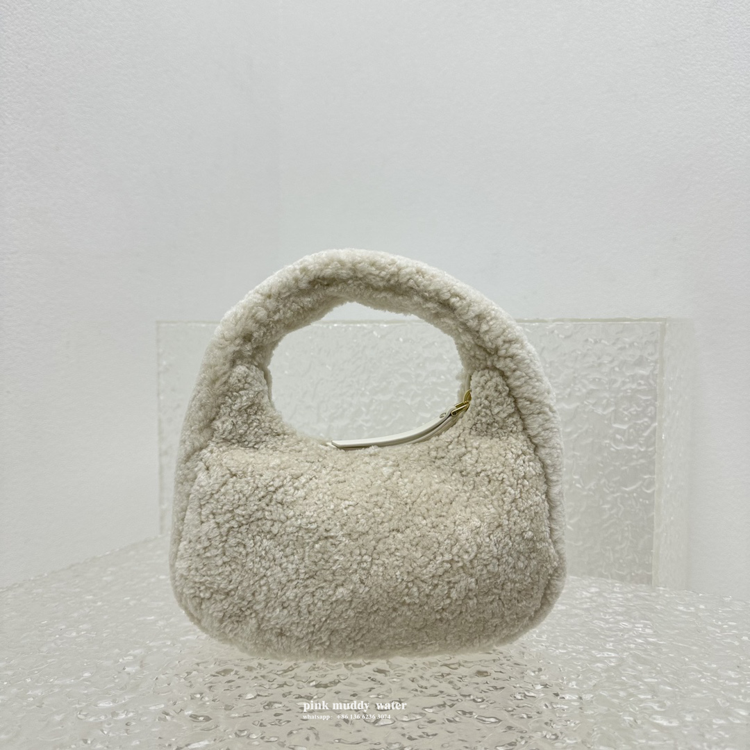 Wander leather detail shearling crescent bag