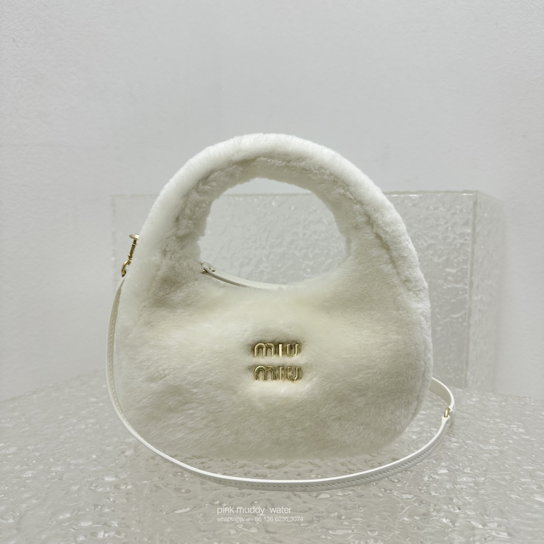 Wander leather detail shearling crescent bag