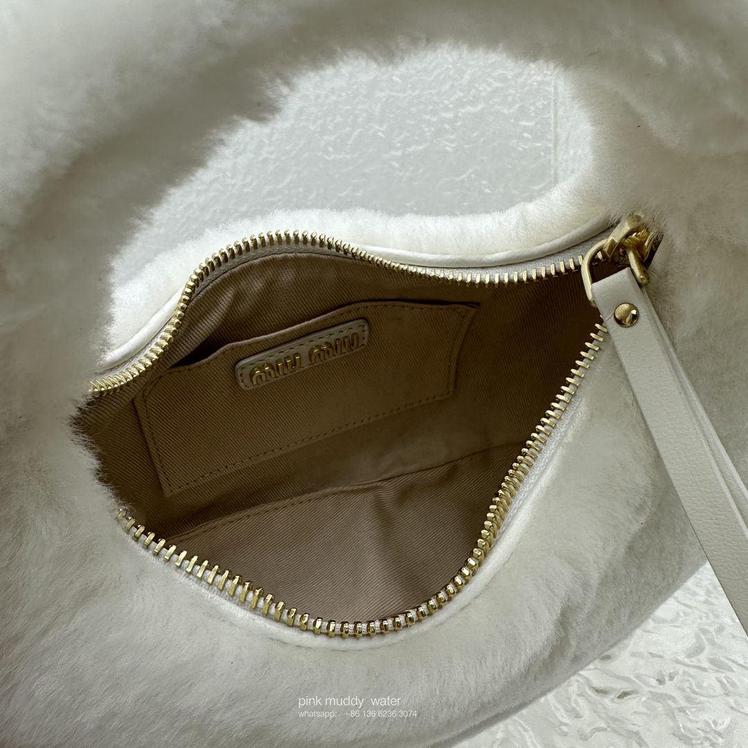 Wander leather detail shearling crescent bag