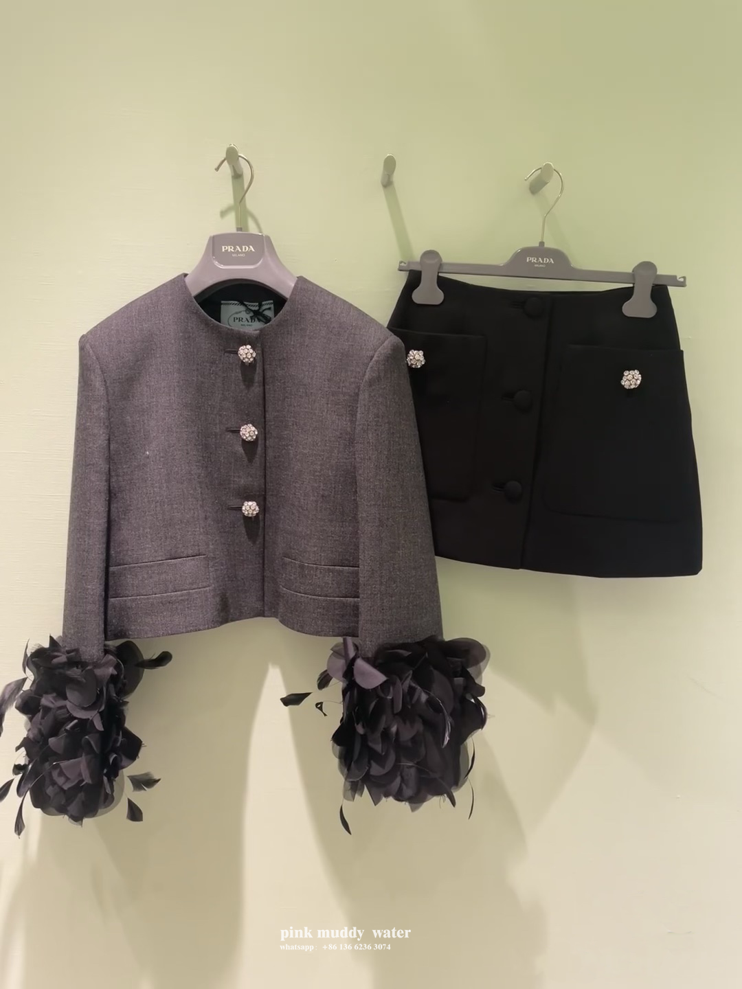 Feather-trimmed single-breasted wool jacket