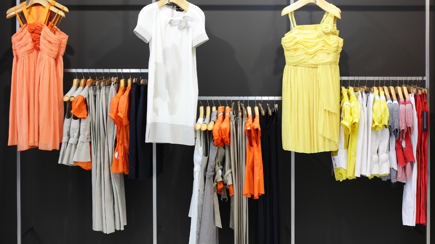 Colorful rack of clothes with various hues and styles hanging neatly, ready to be browsed and worn.