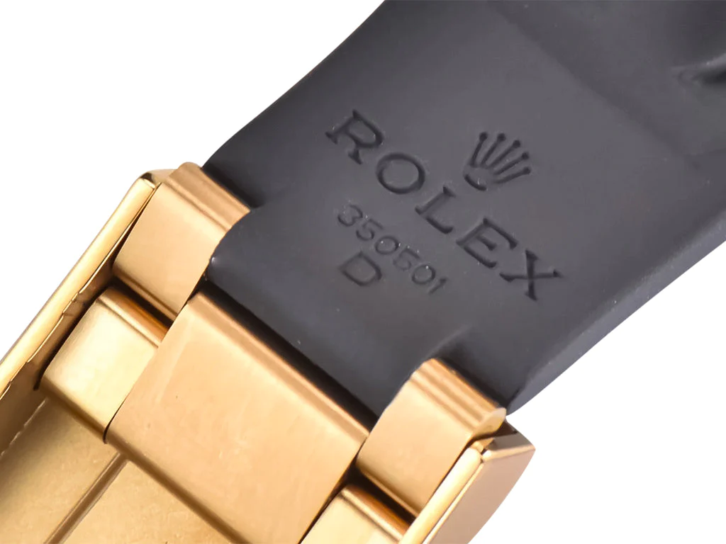 Cosmograph Daytona Yellow Gold Oysterflex with Black and Champagne Dial