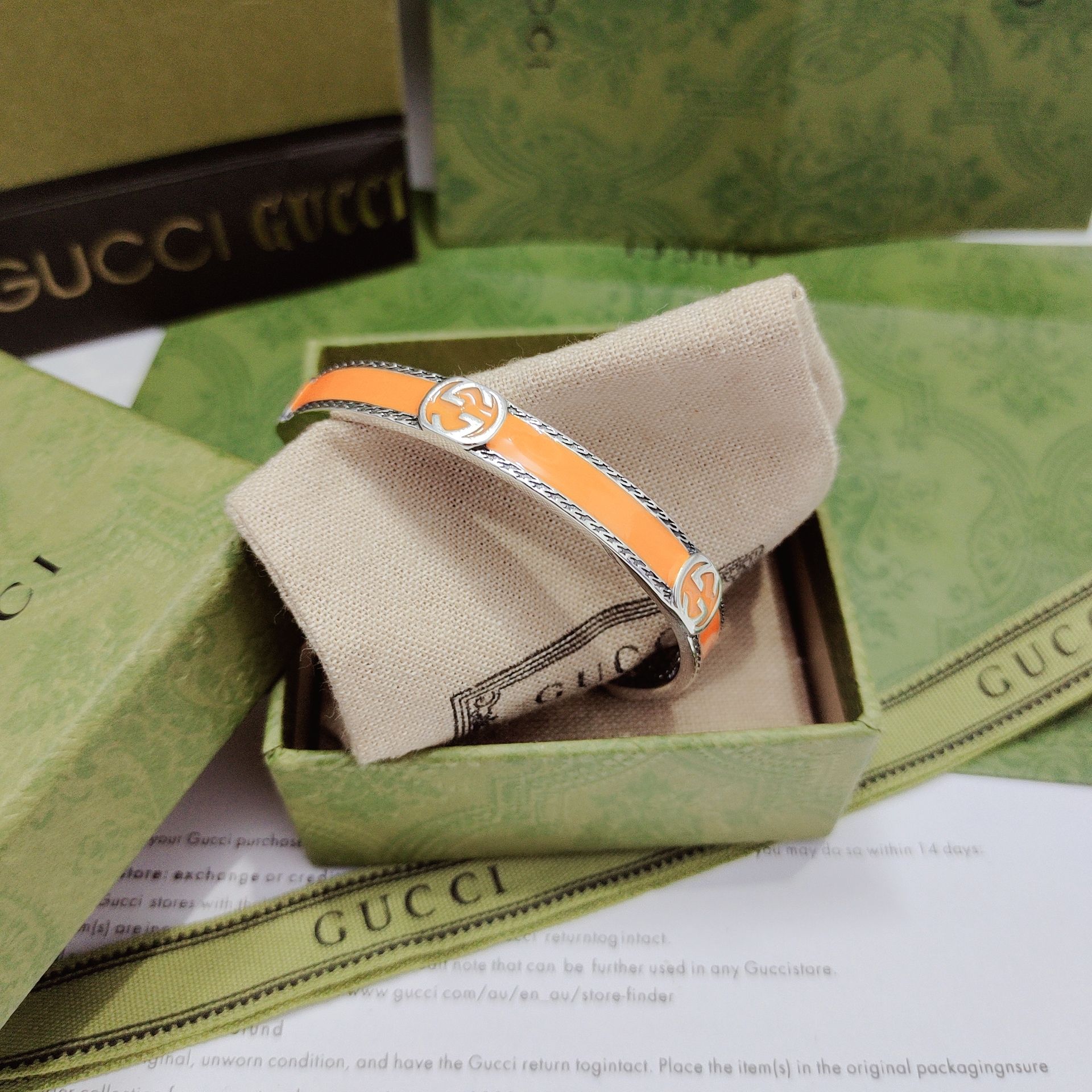 GUCCI-Orange enamel and woven rolled edge bracelet