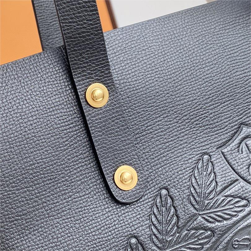 Burberry-Embossed badge leather tote bag