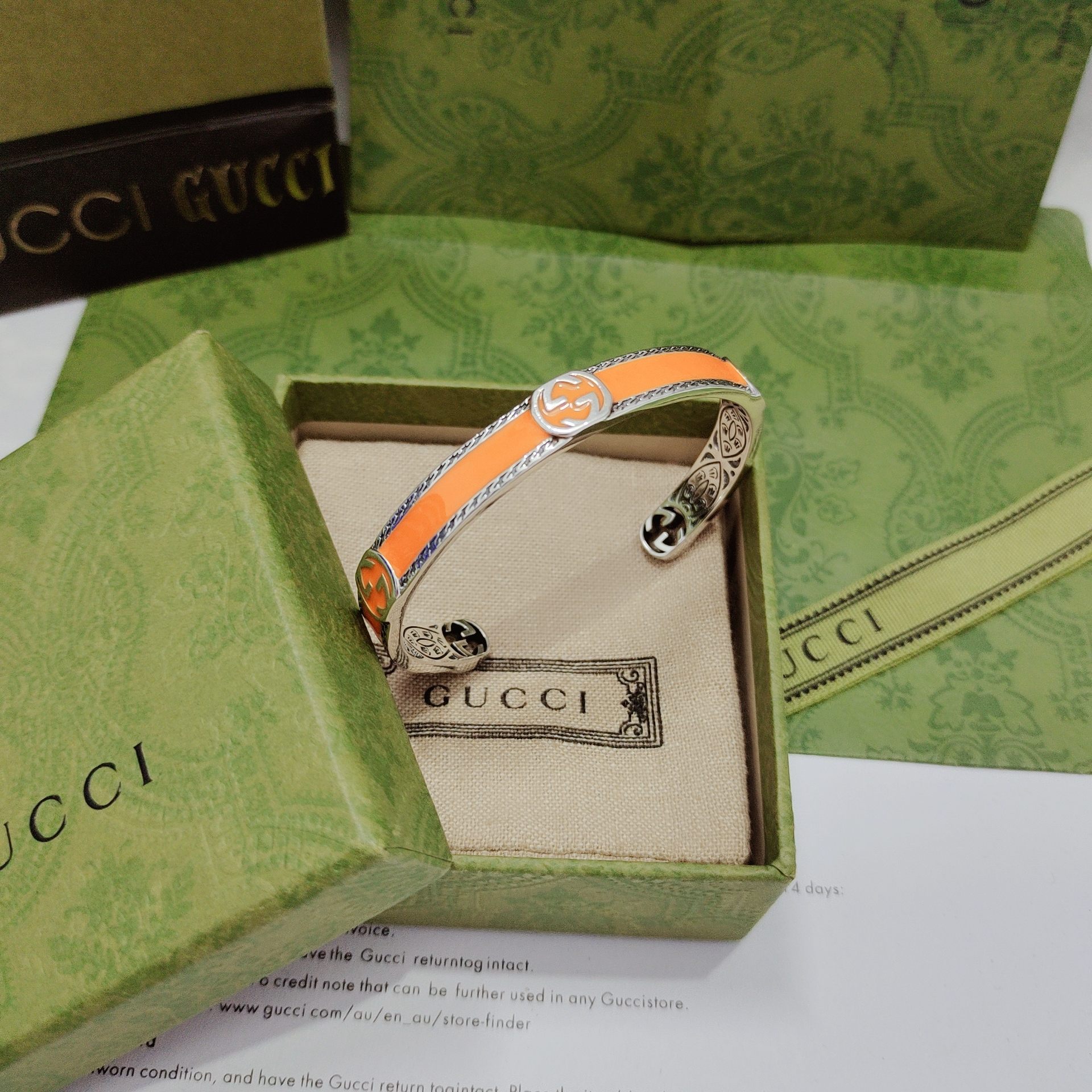 GUCCI-Orange enamel and woven rolled edge bracelet